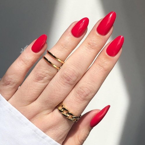 Glossy Poppy Red Nails with Minimalist Charm.